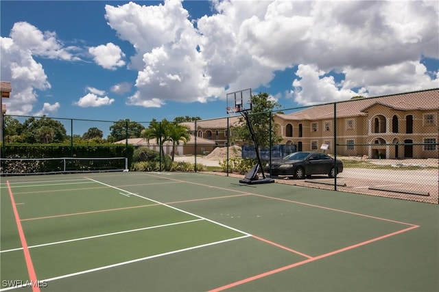 view of sport court featuring basketball hoop