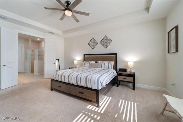 bedroom featuring carpet flooring, a raised ceiling, visible vents, and baseboards