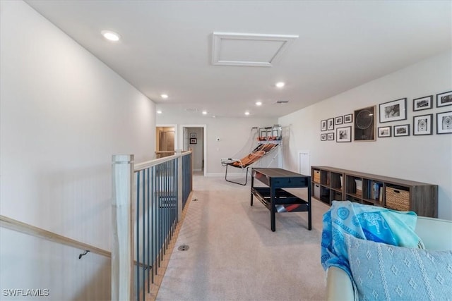 interior space featuring carpet flooring, attic access, and recessed lighting