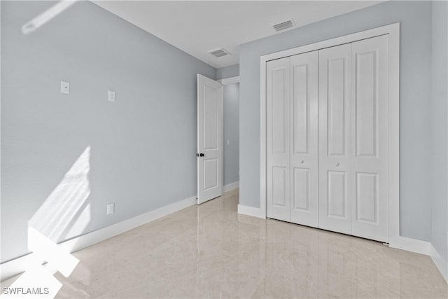 unfurnished bedroom featuring a closet