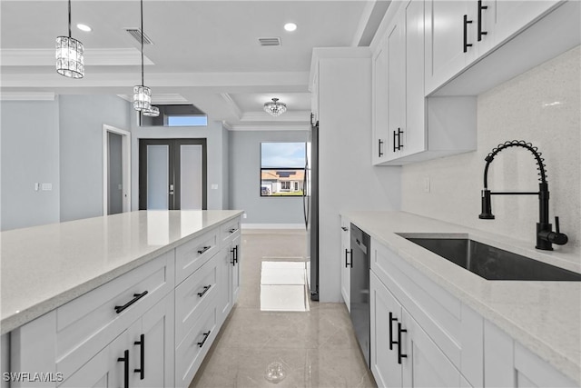 kitchen with sink, dishwasher, white cabinetry, light stone counters, and a tray ceiling