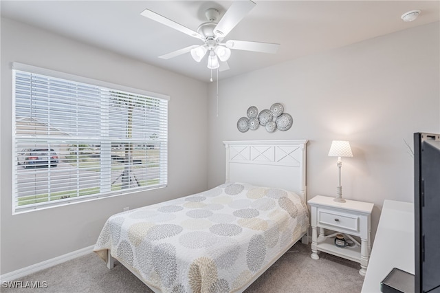 bedroom with ceiling fan and carpet floors