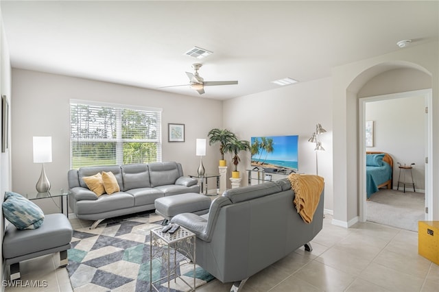 tiled living room featuring ceiling fan