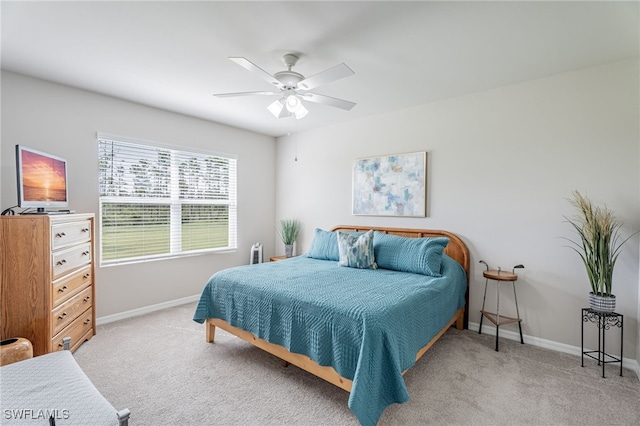 bedroom featuring ceiling fan and light colored carpet