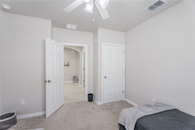 carpeted bedroom with ceiling fan