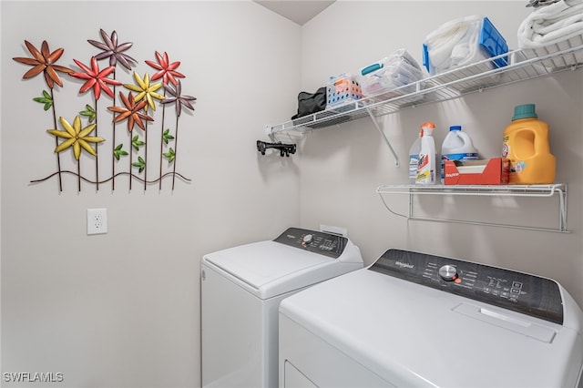 laundry area with independent washer and dryer