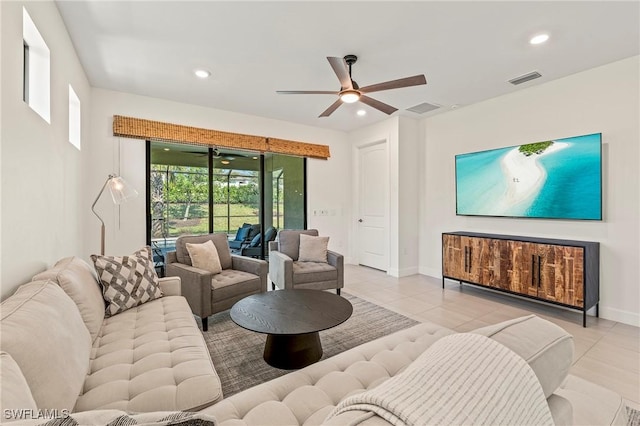 living room with ceiling fan, a healthy amount of sunlight, and light tile patterned floors