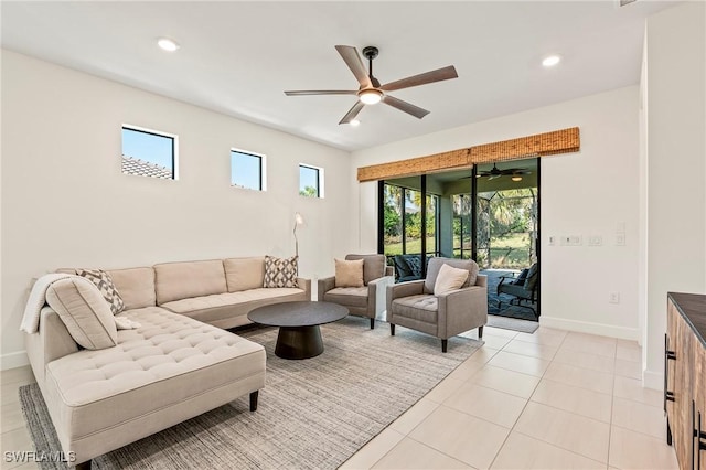 tiled living room featuring plenty of natural light and ceiling fan