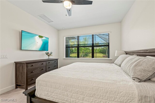 bedroom with light carpet and ceiling fan