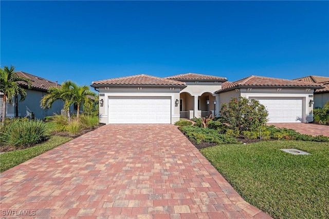 mediterranean / spanish-style home featuring a garage