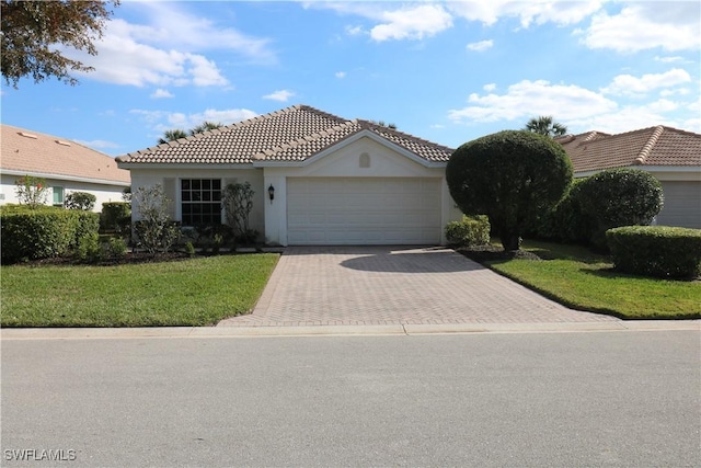 view of front facade with a garage and a front yard