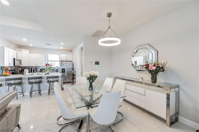 dining space featuring sink