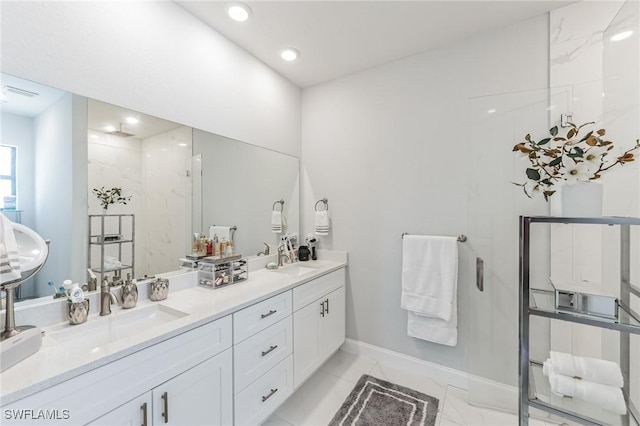 bathroom with vanity and a shower