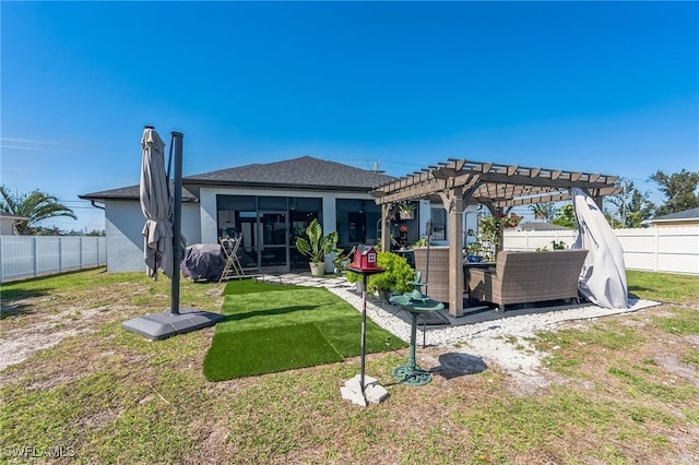 rear view of house with a yard, a pergola, an outdoor living space, and a patio area