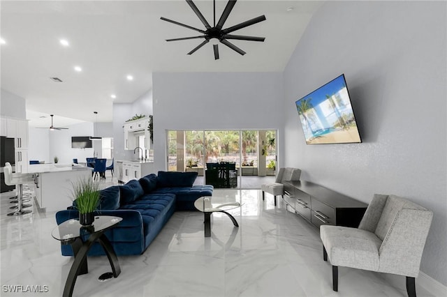 living room with sink and ceiling fan