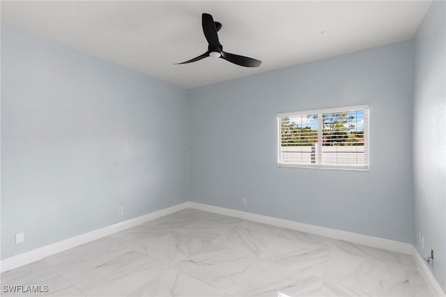 spare room with ceiling fan