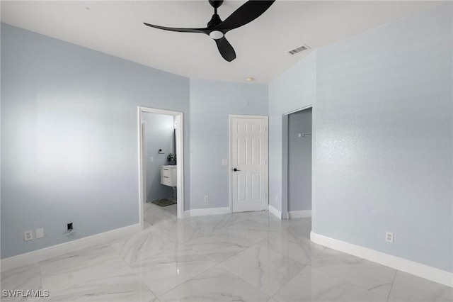 unfurnished bedroom featuring ceiling fan and ensuite bathroom