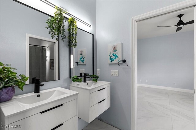 bathroom with ceiling fan and vanity