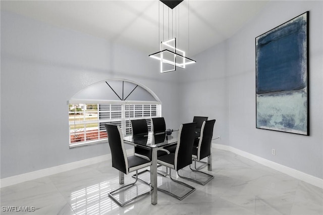 dining area featuring an inviting chandelier