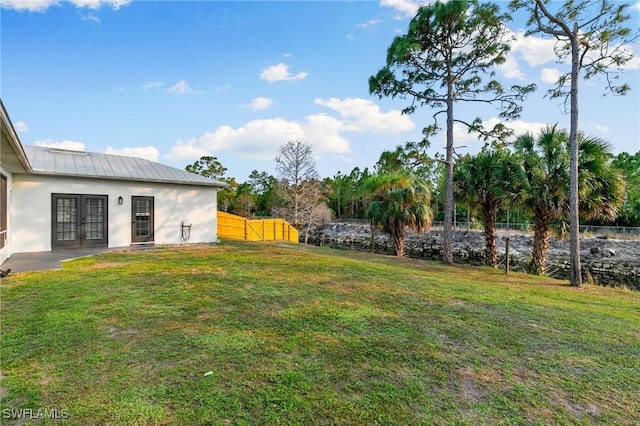 view of yard with french doors