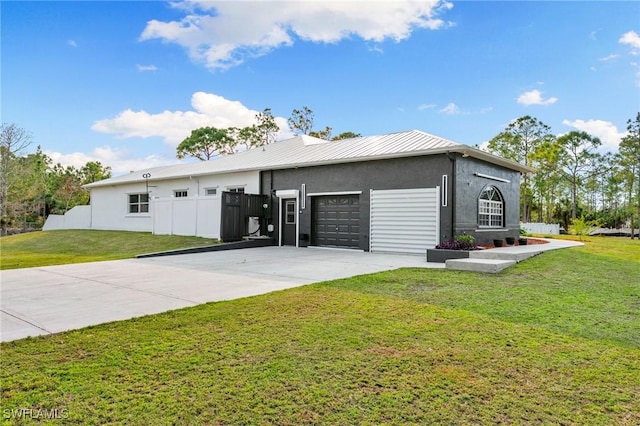 view of front of house with a garage and a front yard