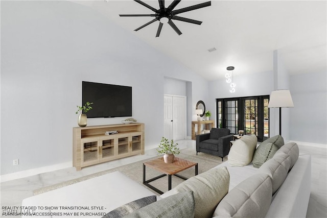 living room featuring ceiling fan and high vaulted ceiling