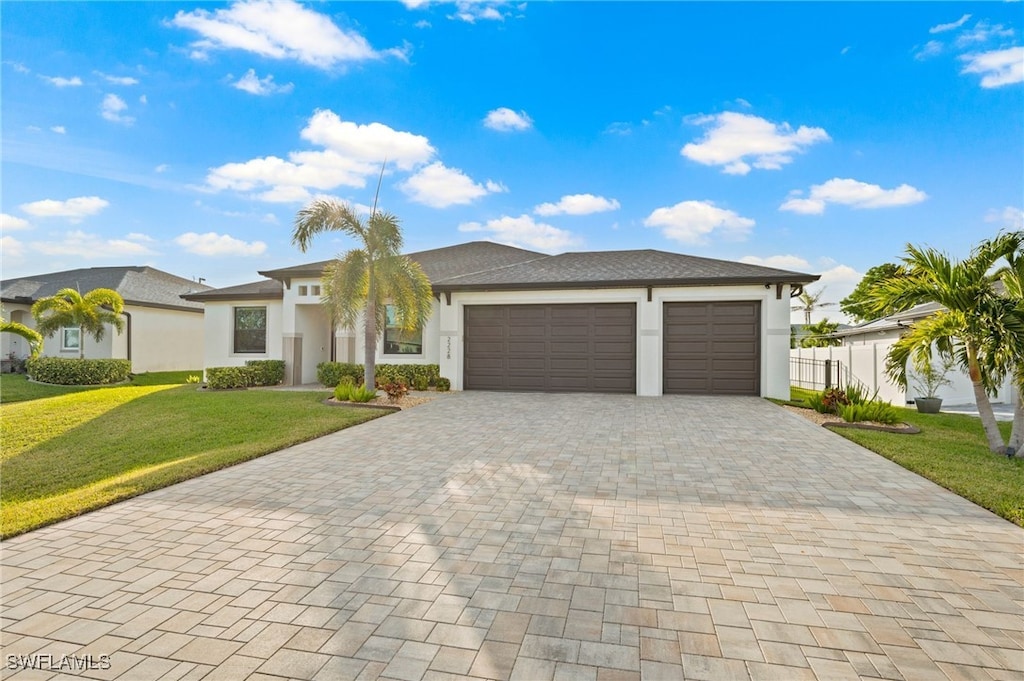 view of front facade featuring a garage and a front lawn