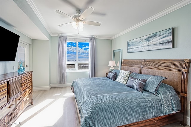 bedroom with crown molding, wood-type flooring, and ceiling fan