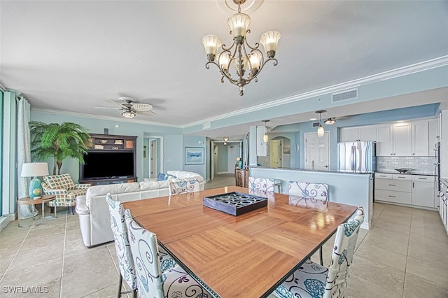 dining space featuring crown molding, ceiling fan with notable chandelier, and light tile patterned floors