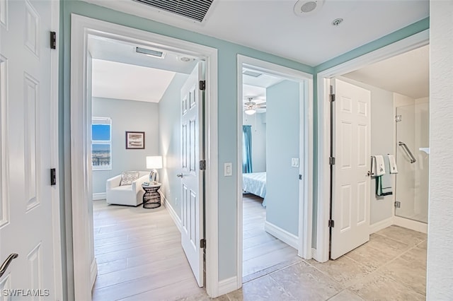 hall with light wood-type flooring