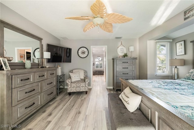 bedroom featuring light hardwood / wood-style floors and ceiling fan