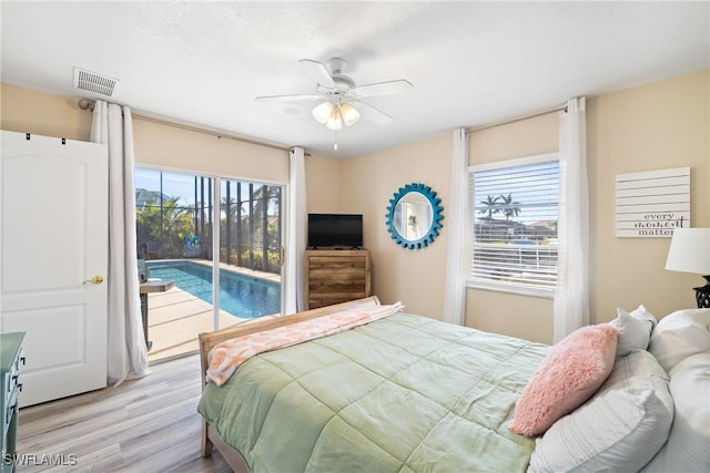 bedroom featuring light wood-type flooring, access to exterior, and ceiling fan