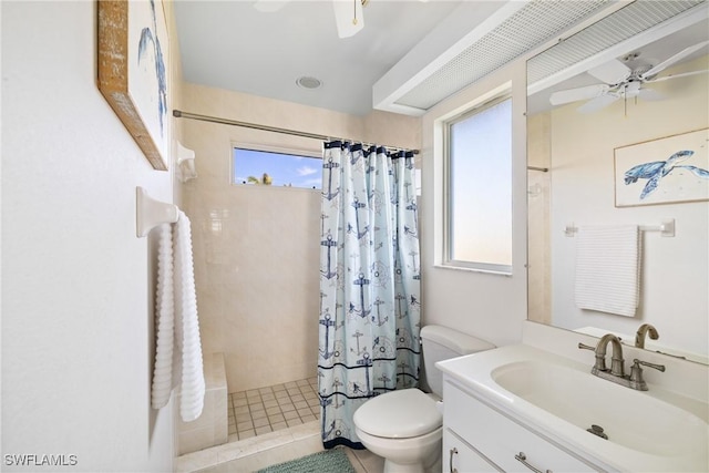 bathroom featuring ceiling fan, vanity, toilet, and a shower with shower curtain