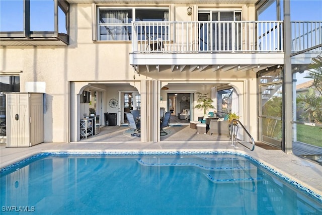 view of pool featuring a patio