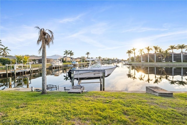 dock area featuring a yard and a water view