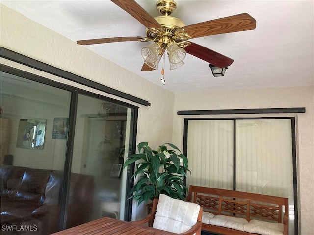 interior space featuring ceiling fan