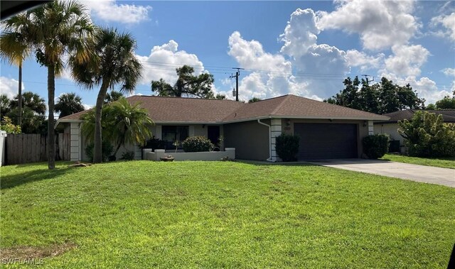 single story home with a garage and a front yard