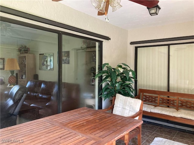 interior space featuring ceiling fan