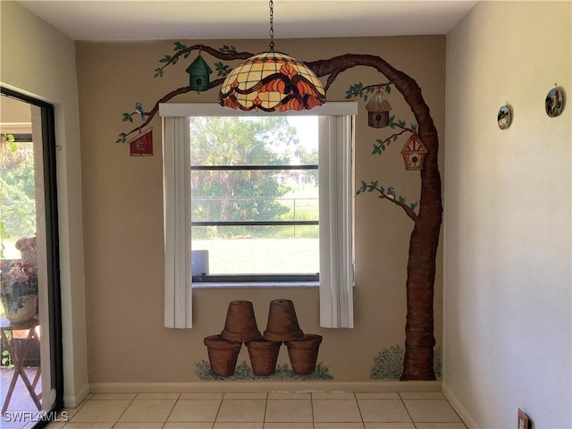 dining area featuring light tile patterned floors