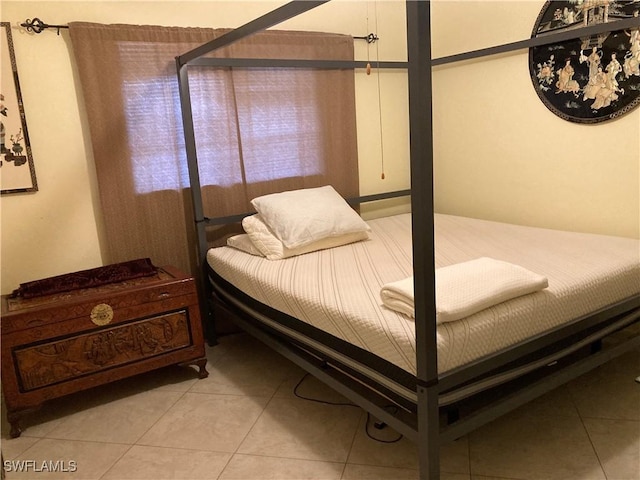 bedroom featuring light tile patterned floors