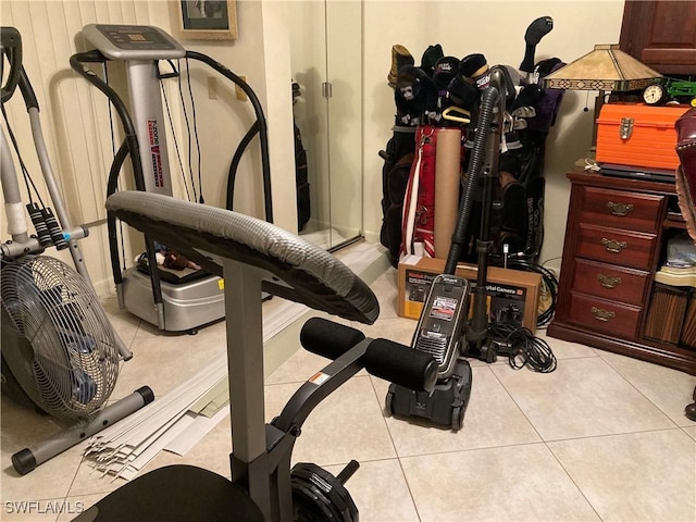 workout room with light tile patterned floors