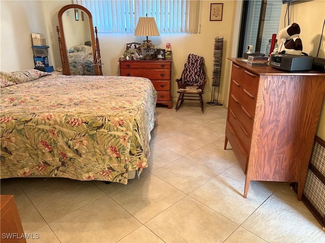 bedroom with light tile patterned flooring