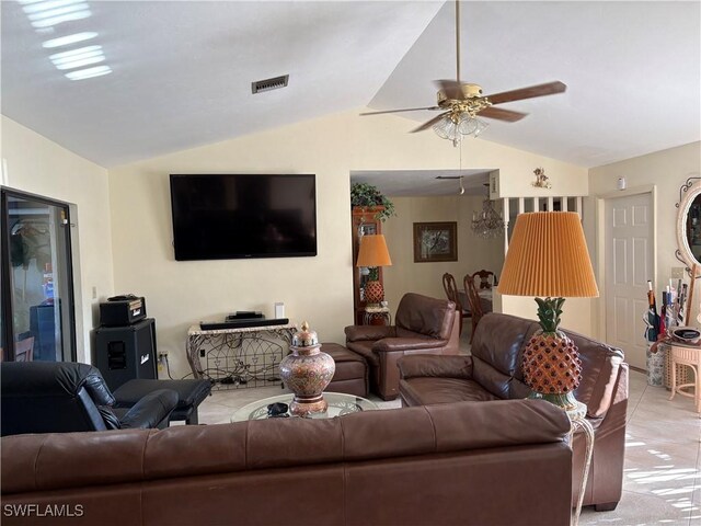 living room with vaulted ceiling, ceiling fan, light tile patterned flooring, and visible vents