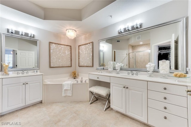 bathroom with independent shower and bath, vanity, and tile patterned flooring