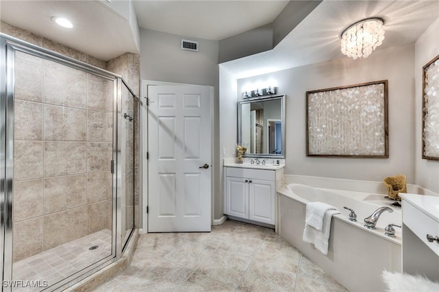 bathroom featuring an inviting chandelier, tile patterned floors, vanity, and separate shower and tub