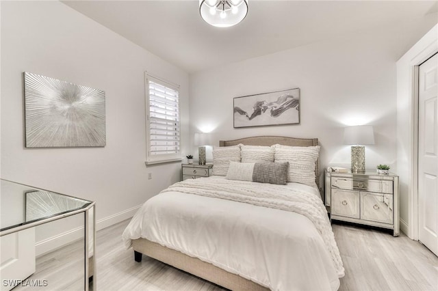 bedroom with light hardwood / wood-style flooring