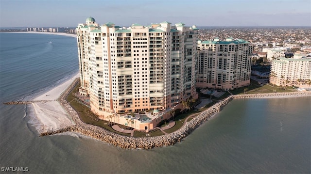 aerial view with a water view and a beach view