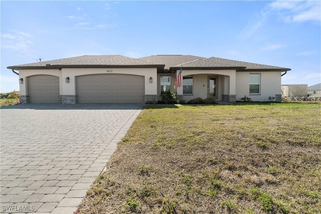 view of front facade with a garage and a front yard