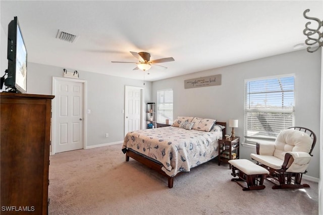 bedroom with ceiling fan and light colored carpet