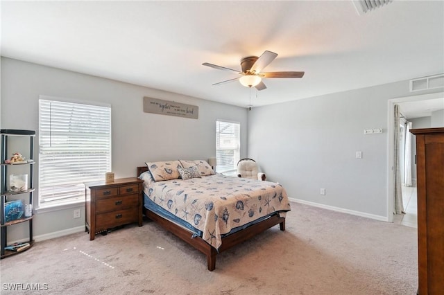 bedroom featuring light colored carpet and ceiling fan